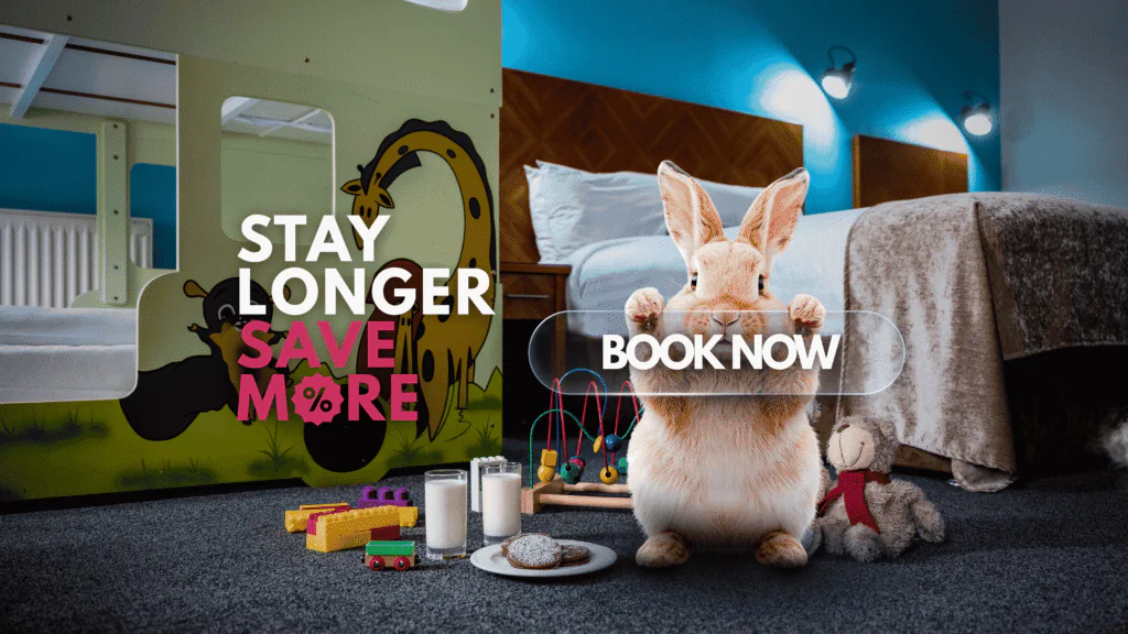 Family-friendly hotel room with children's bunk bed, toys, and a cosy rabbit, offering a warm and delightful stay.